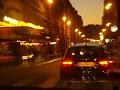 Arrival, zipping through the night streets of Paris by taxi
